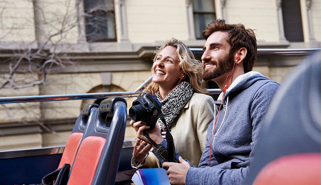 Couple on sightseeing bus